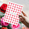 Load image into Gallery viewer, Lifestyle image(s) featuring Tree-Free’s Watercolor Hearts card