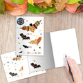 Load image into Gallery viewer, The inside of Tree-Free’s Artful Bats Halloween Card card, with the cover and envelope in the background.