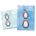 Load image into Gallery viewer, The cover of Tree-Free's Boho Christmas Penguins card, along with its matching envelope.