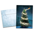 Load image into Gallery viewer, The cover of Tree-Free's Magical Reindeer Holiday Card card, along with its matching envelope.