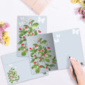 Load image into Gallery viewer, The inside of Tree-Free’s Strawberry Plant Thinking Of You Card card, with the cover and envelope in the background.