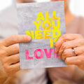 Load image into Gallery viewer, Lifestyle image(s) featuring Tree-Free’s All You Need is Love card