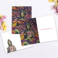 Load image into Gallery viewer, The inside of Tree-Free’s Healing Buddha card, with the cover and envelope in the background.