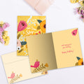 Load image into Gallery viewer, The inside of Tree-Free’s Smell The Flowers Birthday Card card, with the cover and envelope in the background.