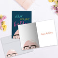 Load image into Gallery viewer, The inside of Tree-Free’s Older Wiser Balder Birthday Card card, with the cover and envelope in the background.