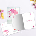 Load image into Gallery viewer, The inside of Tree-Free’s Heart Balloons card, with the cover and envelope in the background.