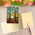 Load image into Gallery viewer, The inside of Tree-Free’s Season of the Soul card, with the cover and envelope in the background.
