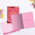 Load image into Gallery viewer, The inside of Tree-Free’s Layers of Hearts card, with the cover and envelope in the background.