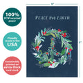 Load image into Gallery viewer, The cover of Tree-Free’s Peace On Earth Wreath Holiday Card card with lines demonstrating its 5x7 dimensions, along with the following text: “100% PCW recycled paper, proudly made in the USA, sustainably printed on extra-thick card stock”
