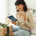 Load image into Gallery viewer, Lifestyle image(s) featuring Tree-Free’s Peace On Earth Wreath card