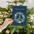 Load image into Gallery viewer, Lifestyle image(s) featuring Tree-Free’s Peace On Earth Wreath card