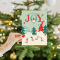 Load image into Gallery viewer, Lifestyle image(s) featuring Tree-Free's Joy Gnomes Holiday Card card