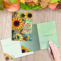 Load image into Gallery viewer, The inside of Tree-Free’s Thankful Sunflowers Thanksgiving Card card, with the cover and envelope in the background.