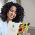 Load image into Gallery viewer, Lifestyle image(s) featuring Tree-Free's Thankful Sunflowers Thanksgiving Card card