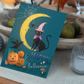 Load image into Gallery viewer, Lifestyle image(s) featuring Tree-Free’s Black Cat And Moon Halloween Card card