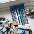 Load image into Gallery viewer, The inside of Tree-Free’s Menorah Candles card, with the cover and envelope in the background.
