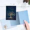 Load image into Gallery viewer, The inside of Tree-Free’s Bird Tree Of Life Solstice Card card, with the cover and envelope in the background.