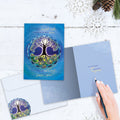 Load image into Gallery viewer, The inside of Tree-Free’s Longest Night Mandala card, with the cover and envelope in the background.