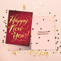 Load image into Gallery viewer, The inside of Tree-Free’s Golden New Year New Year Card card, with the cover and envelope in the background.