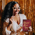 Load image into Gallery viewer, Lifestyle image(s) featuring Tree-Free’s Golden New Year card