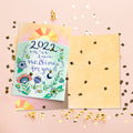 Load image into Gallery viewer, The inside of Tree-Free’s Waiting For 2022 New Year Card card, with the cover and envelope in the background.