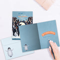 Load image into Gallery viewer, The inside of Tree-Free’s One in a Million card, with the cover and envelope in the background.