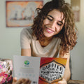 Load image into Gallery viewer, Lifestyle image(s) featuring Tree-Free’s Millennial With Kombucha card