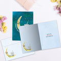 Load image into Gallery viewer, The inside of Tree-Free’s Over The Moon card, with the cover and envelope in the background.