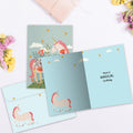 Load image into Gallery viewer, The inside of Tree-Free’s Magical Floral Unicorn card, with the cover and envelope in the background.