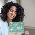 Load image into Gallery viewer, Lifestyle image(s) featuring Tree-Free's Hello Baby card