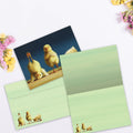 Load image into Gallery viewer, The inside of Tree-Free’s Yoga Chicks card, with the cover and envelope in the background.