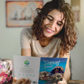 Load image into Gallery viewer, Lifestyle image(s) featuring Tree-Free’s Otterly Amazing card