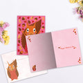 Load image into Gallery viewer, The inside of Tree-Free’s Squirrel Nuts card, with the cover and envelope in the background.