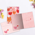 Load image into Gallery viewer, The inside of Tree-Free’s Happy Hearts card, with the cover and envelope in the background.