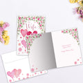 Load image into Gallery viewer, The inside of Tree-Free’s Forever Balloons card, with the cover and envelope in the background.