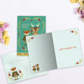 Load image into Gallery viewer, The inside of Tree-Free’s Love You Deerly card, with the cover and envelope in the background.