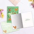Load image into Gallery viewer, The inside of Tree-Free’s Woodland Welcome card, with the cover and envelope in the background.
