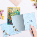Load image into Gallery viewer, The inside of Tree-Free’s Not Alone Birds card, with the cover and envelope in the background.