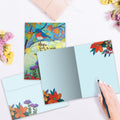 Load image into Gallery viewer, The inside of Tree-Free’s Hopeful Bird card, with the cover and envelope in the background.