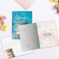 Load image into Gallery viewer, The inside of Tree-Free’s How Many Donuts card, with the cover and envelope in the background.
