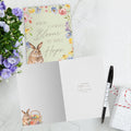 Load image into Gallery viewer, The inside of Tree-Free’s Hope Blooms card, with the cover and envelope in the background.