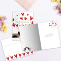 Load image into Gallery viewer, The inside of Tree-Free’s Puppy Love card, with the cover and envelope in the background.