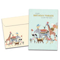 Load image into Gallery viewer, The cover of Tree-Free's Parade on the Way card, along with its matching envelope.