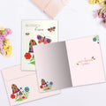 Load image into Gallery viewer, The inside of Tree-Free’s Butterfly Kisses card, with the cover and envelope in the background.