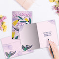 Load image into Gallery viewer, The inside of Tree-Free’s Sending Joy card, with the cover and envelope in the background.