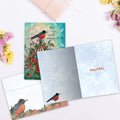 Load image into Gallery viewer, The inside of Tree-Free’s Bird Songs card, with the cover and envelope in the background.