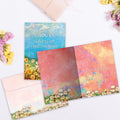 Load image into Gallery viewer, The inside of Tree-Free’s Blue Skies and Sunshine card, with the cover and envelope in the background.