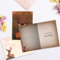 Load image into Gallery viewer, The inside of Tree-Free’s Deer Qualities card, with the cover and envelope in the background.