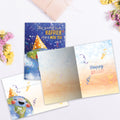 Load image into Gallery viewer, The inside of Tree-Free’s Happier World card, with the cover and envelope in the background.