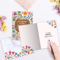 Load image into Gallery viewer, The inside of Tree-Free’s Greatest Kindness card, with the cover and envelope in the background.